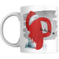 Christmas mug with red glitter letter P, Santa hat, sleigh silhouette, snowman, and pine trees. Festive ceramic drinkware for holiday gifting.