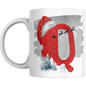 Christmas mug with red letter Q, Santa hat, sleigh silhouette, snowman, and snowy trees. Festive ceramic drinkware for holiday gifting.