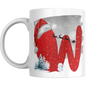 Christmas mug with red letter W, Santa hat, sleigh silhouette, snowman, and snowy trees. Festive ceramic drinkware for holiday gifting.